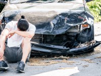 Matlin-Injury-Law-Stock-Photos-02-man-crying-on-his-old-damaged-car-after-crash-acci-2021-08-31-04-26-46-utc-1.jpg