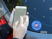 young-woman-calling-for-roadside-assistance-on-her-iphone6-plus-aaa-HGF3D1-1.jpg