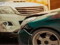 types-of-car-accidents-green-and-white-car-damaged-bumper-and-headlights-1.jpeg